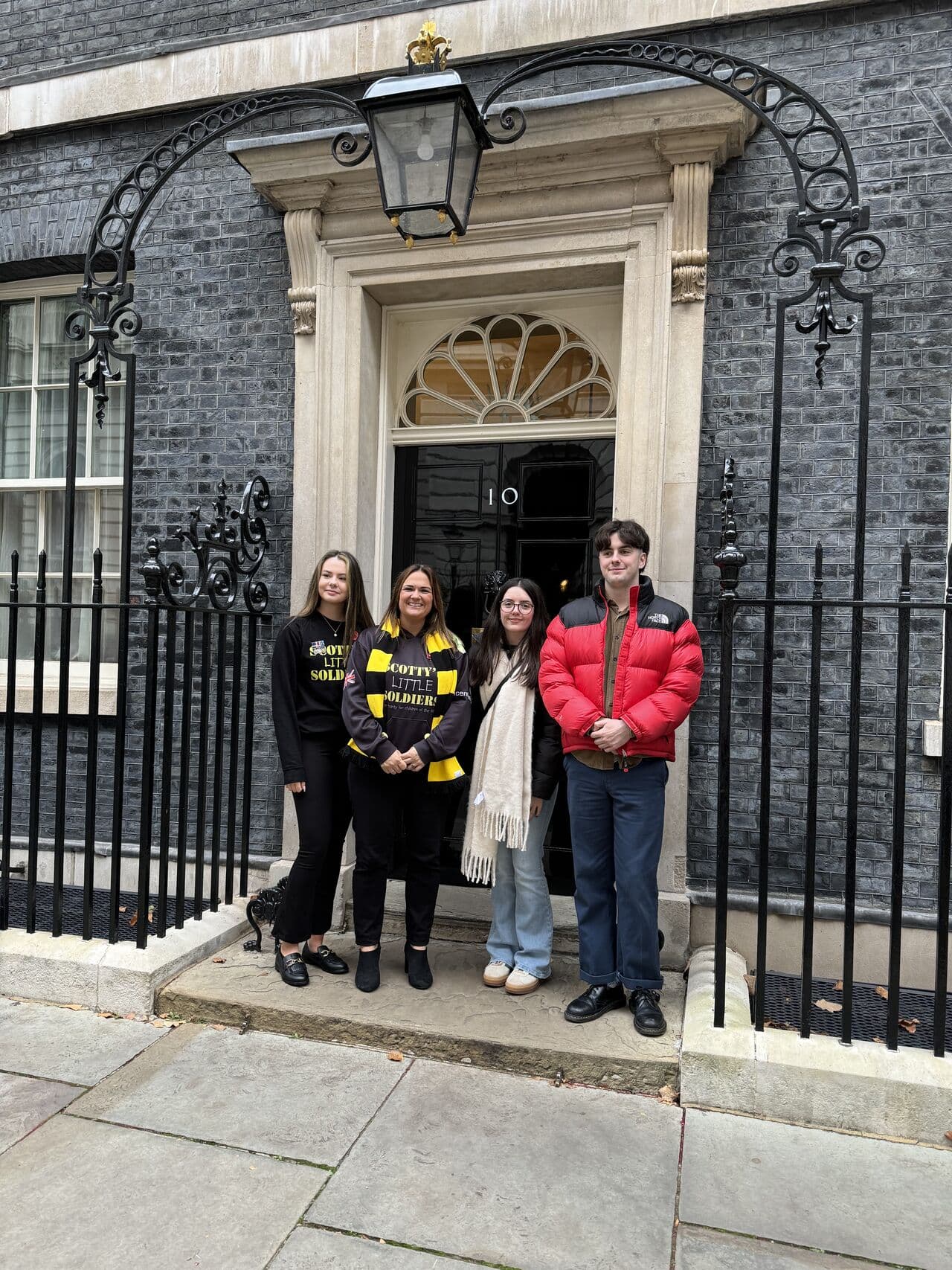 Scotty's founder Nikki Scott with Scotty Council members outside No.10 Downing Street after a meeting with the Prime Minister